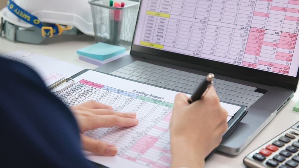 woman-cost-estimating-on-laptop-and-documents